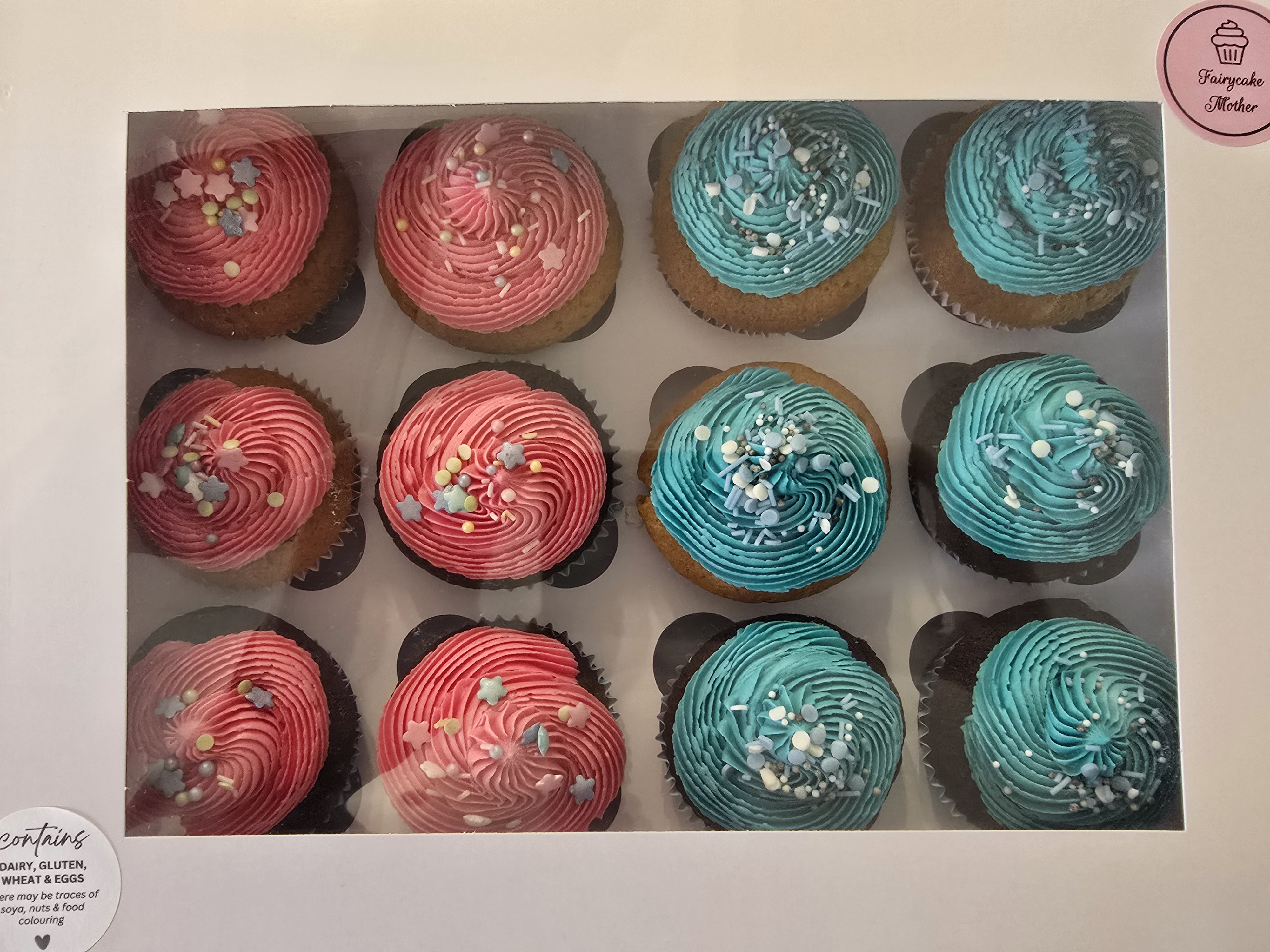 Delicious box of Pink and Blue Cupcakes with sprinkles